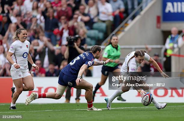 Emma Sing of England scores her team's second try whilst under pressure from Marine Menager of France during the Guinness Women's Six Nations 2025...