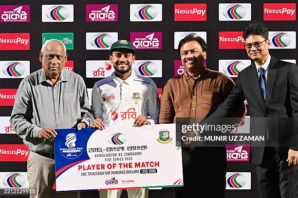 Bangladesh's captain Najmul Hossain Shanto receive 'Man of the series' from Bangladesh cricket board president Faruk Ahmed following the presentation...