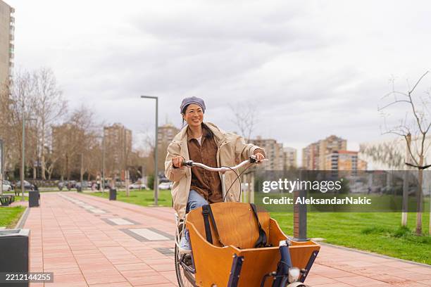 through the city by cargo bike - cargo bike stock pictures, royalty-free photos & images