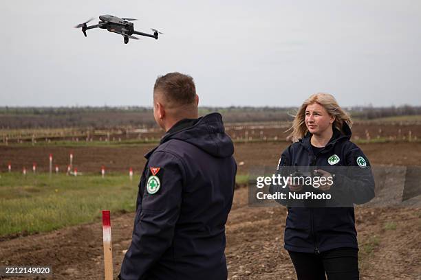 Nataliia Horun, a demining expert with the Norwegian People's Aid, pilots a drone during a mine clearance mission in the Mykolaiv region, Ukraine, on...