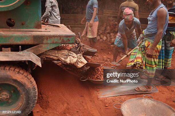 Laborers work in an unhealthy environment in Dhaka, Bangladesh, on April 30, 2025. Every year, May 1 is celebrated as International Labor Day all...