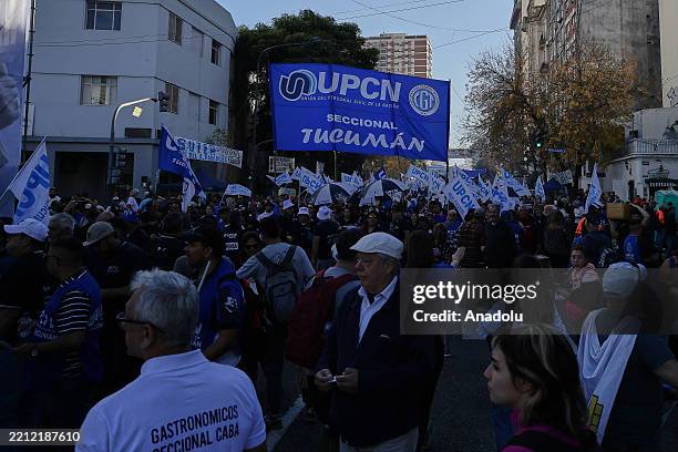 People take part in a massive march organized by the General Confederation of Labor to mark International Workers' Day in Buenos Aires, Argentina on...
