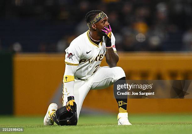 Andrew McCutchen of the Pittsburgh Pirates looks on after a fan fell from the stands during the seventh inning against the Chicago Cubs at PNC Park...