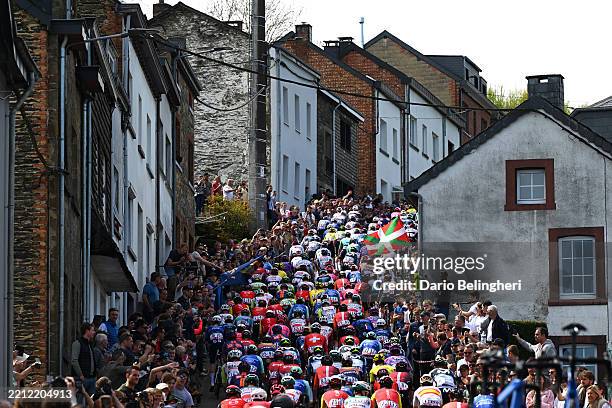 General view of the peloton climbing to the Côte de Saint-Roch while fans cheer during the 111st Liege - Bastogne - Liege 2025 a 252km one day race...