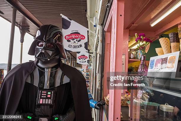 The Star Wars character Darth Vader waits at an ice cream parlour on day two of the Scarborough Sci Fi weekend on April 27, 2025 in Scarborough,...