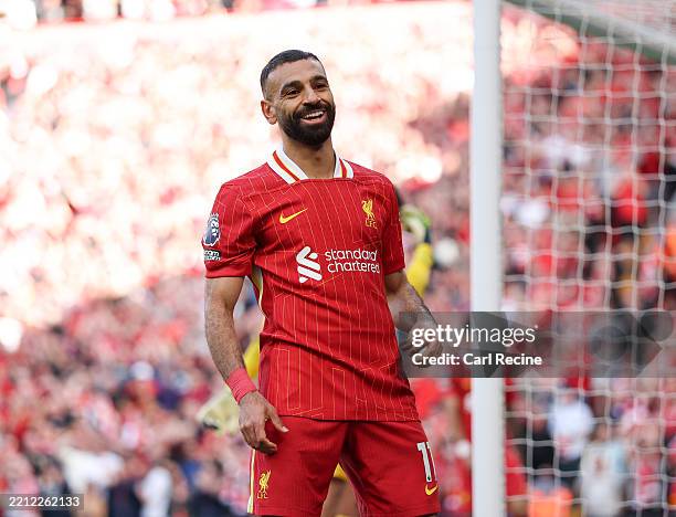 Mohamed Salah of Liverpool celebrates scoring his team's fourth goal during the Premier League match between Liverpool FC and Tottenham Hotspur FC at...