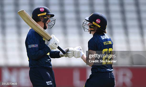 Durham batters Hollie Armitage and Mady Villiers punch gloves during the Metro Bank One Day Cup match between Durham Women and The Blaze at Banks...