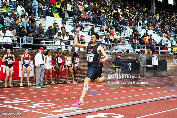 Gabriel Rodriguez of the Rutgers Scarlet Knights reacts after winning the College Men's 4x800 relay during the Penn Relays at Franklin Field at the...