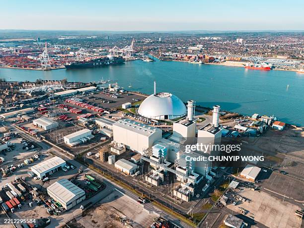 marchwood power station dominating southampton industrial area aerial view - gas turbine stock pictures, royalty-free photos & images