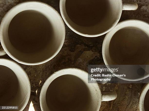 clay pottery being produced by a workplace - pakistan market stock pictures, royalty-free photos & images