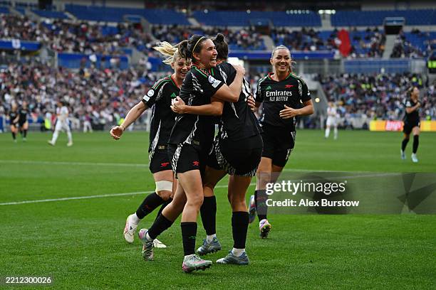 Caitlin Foord of Arsenal celebrates scoring her team's fourth goal with teammate Mariona Caldentey during the UEFA Women's Champions League Semi...