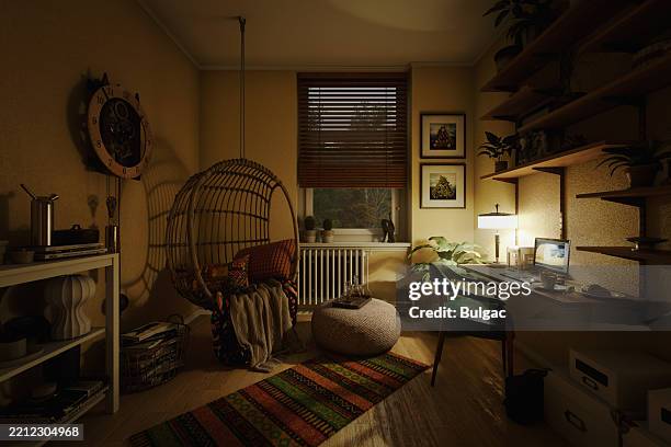 boho home office with hanging egg chair and floating desk - low lighting stock pictures, royalty-free photos & images