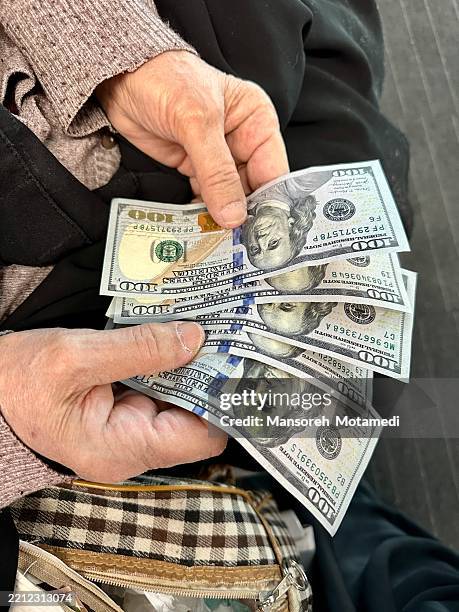 counting dollars - currency symbol stock pictures, royalty-free photos & images
