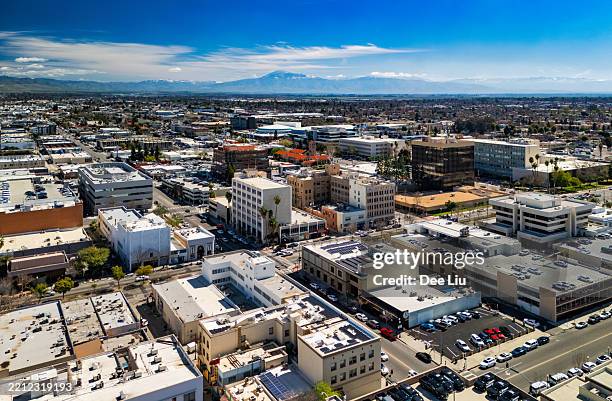 bakersfield downtown aerial with sierra nevada mountains - bakersfield stock pictures, royalty-free photos & images