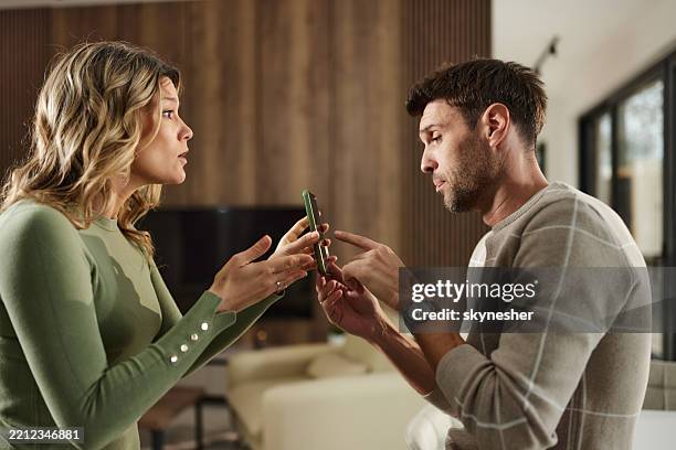 i don't know this man who sent you a text message! - relationship difficulties stock pictures, royalty-free photos & images