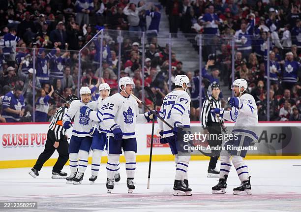Max Pacioretty of the Toronto Maple Leafs celebrates his third period goal with Chris Tanev, Jake McCabe, Pontus Holmberg and Max Domi against the...