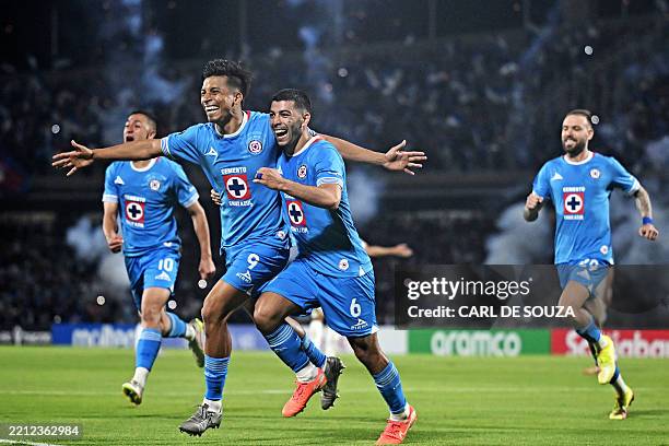 Cruz Azul's forward Angel Sepulveda celebrates with teammate midfielder Erik Lira after scoring a penalty kick and his team's first goal during the...