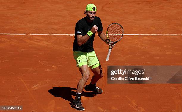 Jacob Fearnley of Great Britain celebrates against Grigor Dimitrov of Bulgaria during the Round of 32 match on Day Seven of the Mutua Madrid Open at...