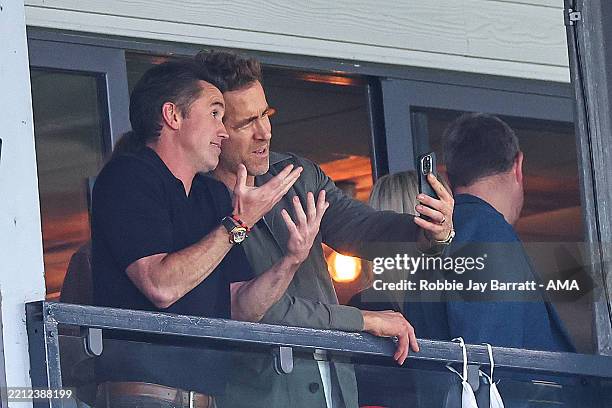 Rob McElhenney and Ryan Reynolds co-owners of Wrexham react during the Sky Bet League One match between Wrexham AFC and Charlton Athletic FC at...