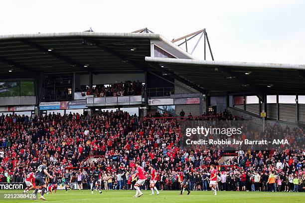 General view as fans of Wrexham prepare to run on the pitch securing promotion to the Championship during the Sky Bet League One match between...