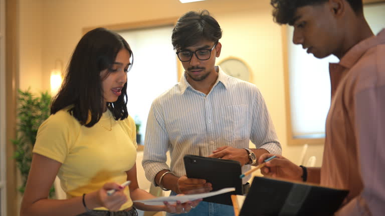 https://media.gettyimages.com/id/2212403541/video/focused-young-team-discussing-ideas-holding-tablet-and-papers-in-a-modern-office-setup.jpg?b=1&s=640x640&k=20&c=YzU6uzYMSGlokqCAwXTXVVPF__yxLJ5MB7fvrGLgAYY=
