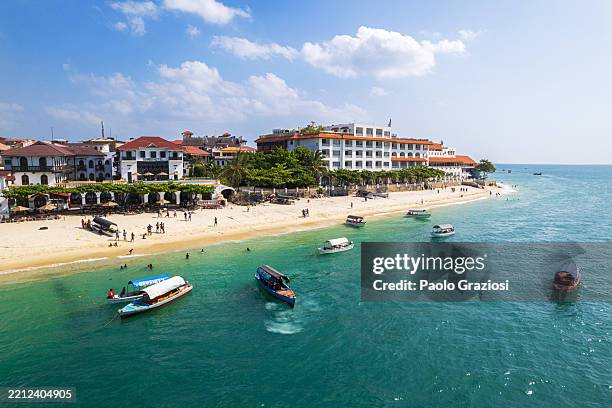 elegant buildings along the coast, stone town, zanzibar, tanzania, africa - tanzania stock pictures, royalty-free photos & images