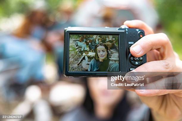 friends using early 2000s digital compact camera - digital camera stock pictures, royalty-free photos & images