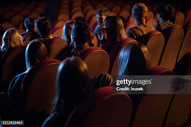 young people in movie theater - film festival stock pictures, royalty-free photos & images
