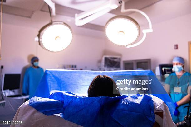 a woman being prepared for surgery - c section stock pictures, royalty-free photos & images
