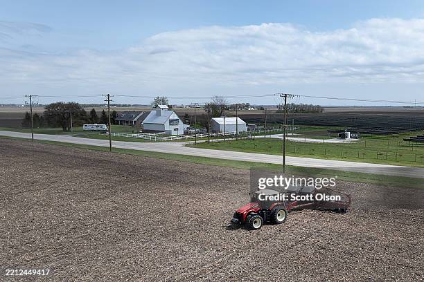 In this aerial view, Dan Duffy uses a tractor to plant soybeans on land he farms with his brother on April 28, 2025 near Dwight, Illinois. Duffy,...