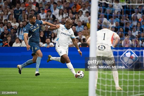 Former Ivorian forward Didier Drogba kicks the ball during a Legends football match to celebrate the 125th Anniversary of Olympique de Marseille...
