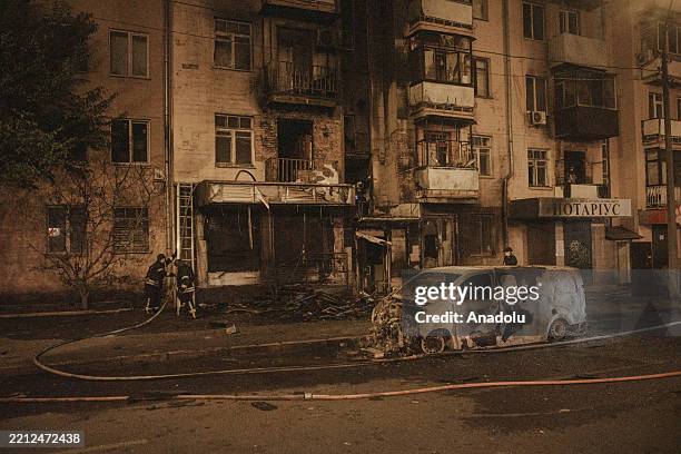 Firefighters continue their work in a damaged building after Russian massive drone strike on Kharkiv, Ukraine on May 02, 2025. According to current...