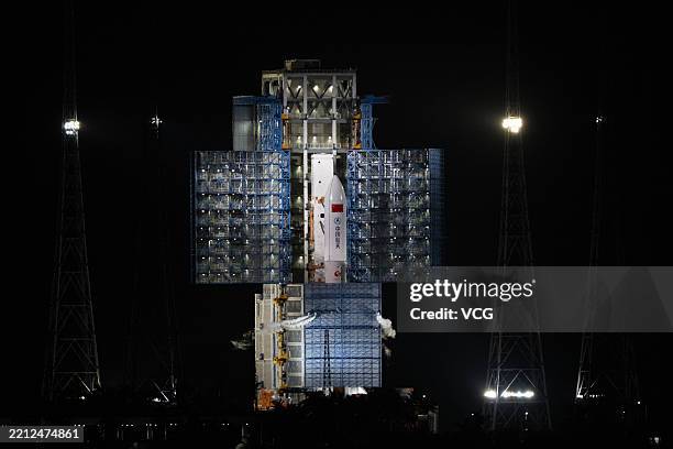 The combination of a Long March-5B carrier rocket and a satellite group is vertically transferred to the launching area at the Wenchang Space Launch...