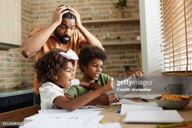oh no, they are fighting over touchpad! - watching parents fight stock pictures, royalty-free photos & images
