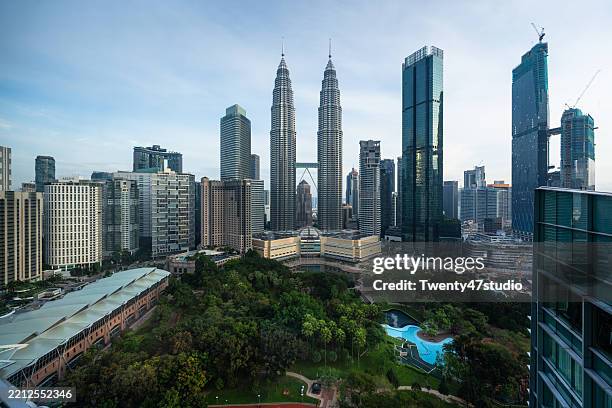 kuala lumpur petronas towers and skyscrapers view in the morning - kuala lumpur stock pictures, royalty-free photos & images