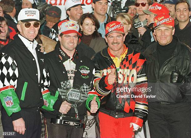 Team owner Joe Gibbs , drivers Bobby Labonte, Terry LaBonte and team owner Rick Hendrick celebrate after the NAPA 500 NASCAR event at Atlanta Motor...
