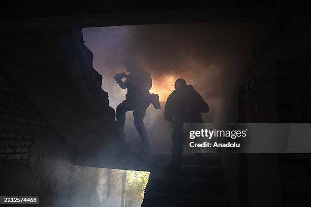 New infantry recruits aged 18-24 train in a mock assault on a building in Donetsk Oblast, Ukraine on May 03, 2025. Ukraine is offering one-year army...