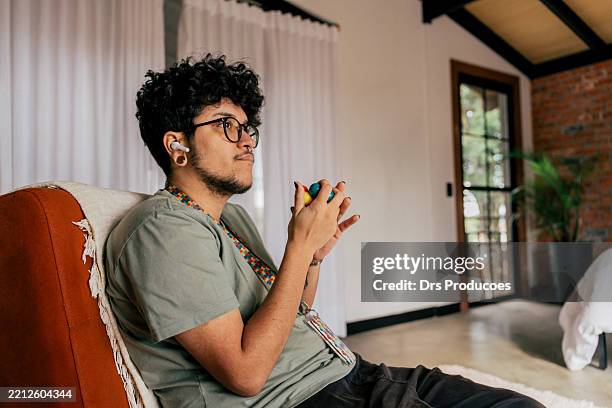 adult autistic person with anti-stress object - neurodiversity stock pictures, royalty-free photos & images