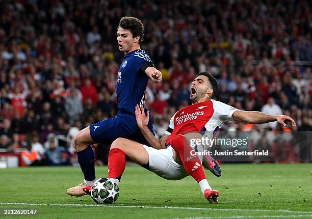 Mikel Merino of Arsenal is challenged by Joao Neves of Paris Saint-Germain during the UEFA Champions League 2024/25 Semi Final First Leg match...