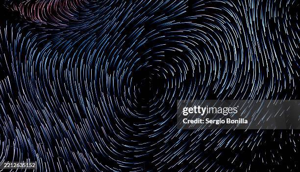 swirling pattern of curved lines on a dark background creating a dynamic abstract effect. 3d rendering - desk background stock illustrations