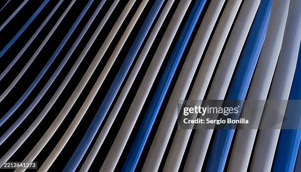 abstract pattern of blue and beige curved lines on a dark background. blender 3d illustration - screen saver stock illustrations