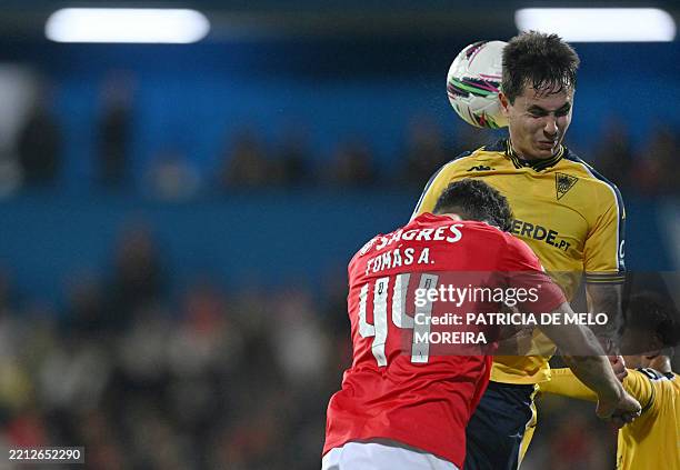 Benfica's defender Tomas Araujo and Estoril's Brazilian midfielder Vinicius Nelson de Souza Zanocelo vie for a header during the Portuguese League...