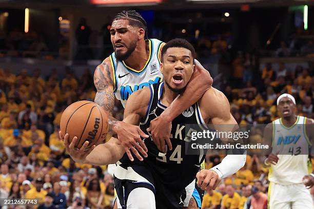 Obi Toppin of the Indiana Pacers fouls Giannis Antetokounmpo of the Milwaukee Bucks during the second quarter of Game 5 of the 2025 NBA Playoffs at...
