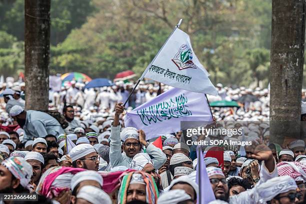 Thousands of leaders and activists of Hefazat-e-Islam Bangladesh holding flags gather to express their opinion during the grand rally at Suhrawardy...
