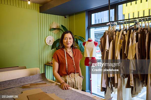 female small business owner working in her textile design studio - tailor stock pictures, royalty-free photos & images