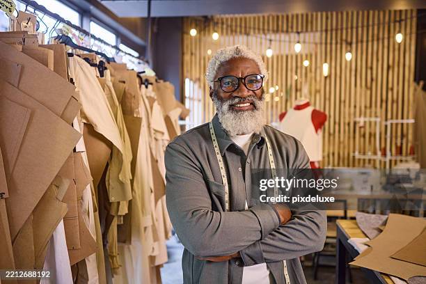 senior tailor smiling with confidence in his workshop - tailor stock pictures, royalty-free photos & images