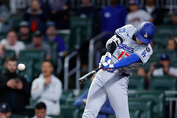 Shohei Ohtani of the Los Angeles Dodgers hits a single during the first inning against the Atlanta Braves at Truist Park on May 3, 2025 in Atlanta,...
