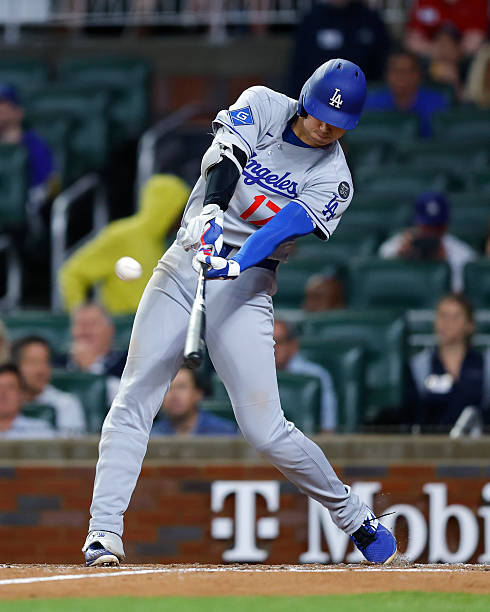 Shohei Ohtani of the Los Angeles Dodgers hits a solo home run during the third inning against the Atlanta Braves at Truist Park on May 3, 2025 in...