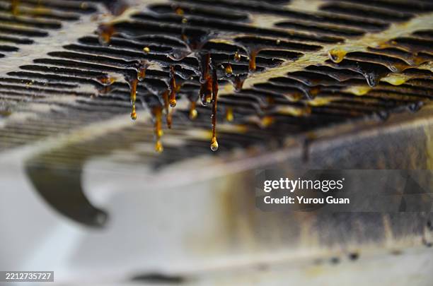 close-up of a kitchen range hood heavily soiled with stubborn grease and oil stains, showcasing one of the most frustrating household cleaning challenges. - exaustor de cozinha imagens e fotografias de stock