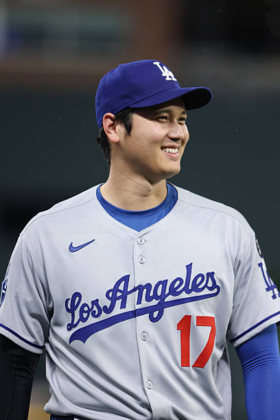 Shohei Ohtani of the Los Angeles Dodgers looks on during the game between the Los Angeles Dodgers and the Atlanta Braves at Truist Park on Saturday,...